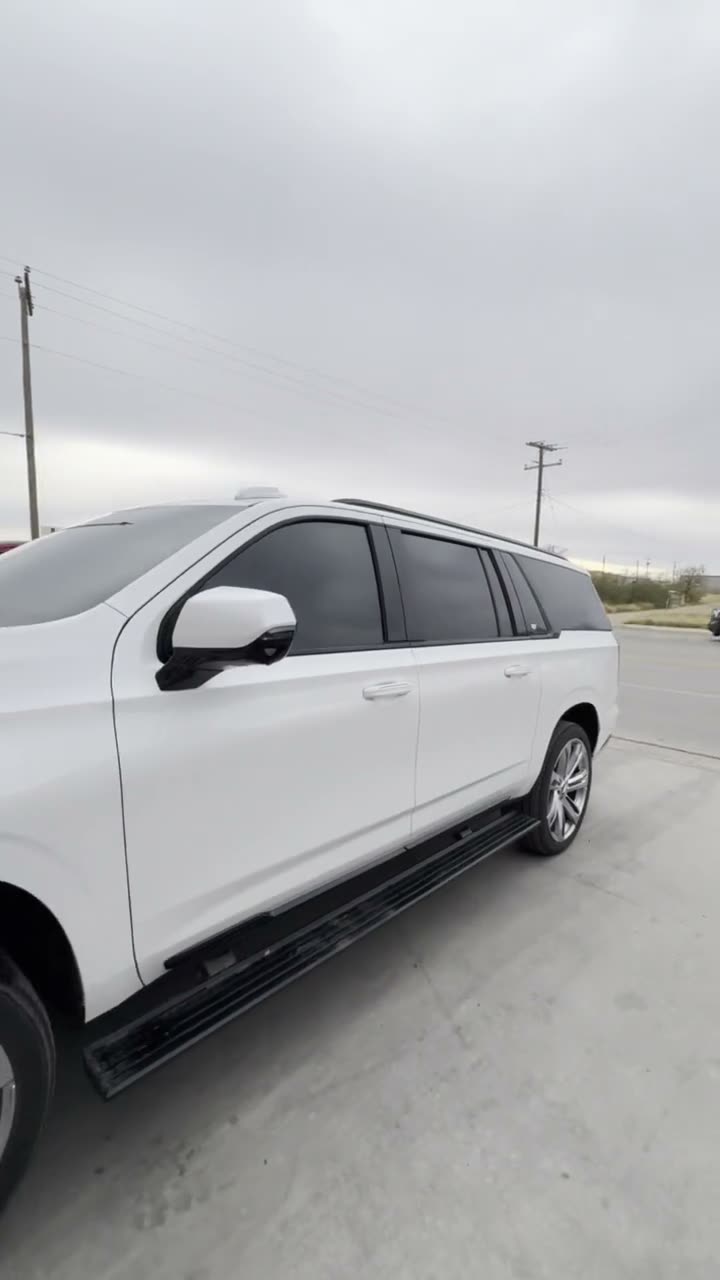 Finished luxury SUV tint job showing a premium side profile and dark privacy glass.